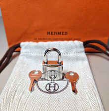 Cadenas Hermès argenté neuf/