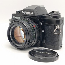 Appareil photo reflex argentique Minolta X-500 " NEAR MINT +" avec MD Rokor...