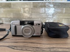 Appareil photo argentique Canon prima super 135 , fonctionnel .