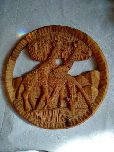 Round wooden african hand - round,