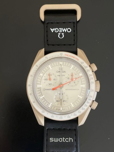 Pile montre quartz omega - de, à