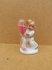 Ancien sablier en porcelaine allemande représentant un groom Marqué Germany