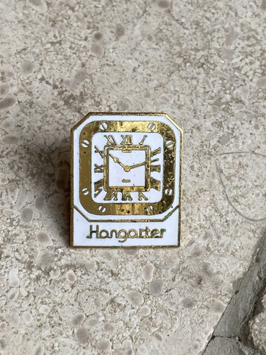 Pin hangarter montre - pin’s, ++