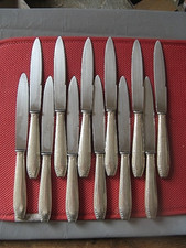++"530.10"  12 COUTEAUX DE TABLE MANCHE  EN METAL ARGENTE  ORFEVRE  "ORBRILLE"