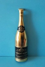 Ancien décapsuleur vintage en forme de bouteille de champagne métal argenté 1960