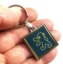 Ancien porte cle métal et epoxy Automobile PEUGEOT Garage Oullins 69