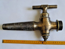 robinet géant bronze