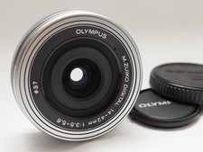 COMME NEUF : objectif Olympus