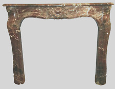cheminée louis XV en marbre rouge jambage galbée finement sculpté . XIX siècle .