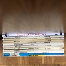 Lot 14 Bandes Dessinées / 9 Astérix / 2 Gaston / 1 Man/  1 Largo Winch/ 1 Sempé