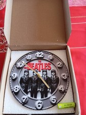 HORLOGE MURALE A L'EFFIGIE DE THE BEATLES- NEUVE - FRAIS DE PORT OFFERT -