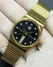 MONTRE RADO VOYAGER RONDE NOIRE VINTAGE PLAQUÉ OR SWISS MADE AUTOMATIQUE...