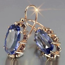 Boucles D’oreilles Pendantes Au Cristal Bleu Clair Et Monture Dorée Dentelée