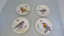 4 assiettes porcelaine décor