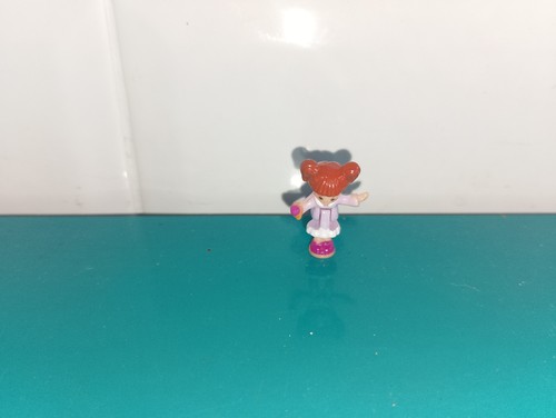 Polly pocket figurine doll