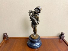 Sculpture en bronze garçon à
