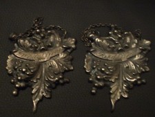 Pair of white metal decorative