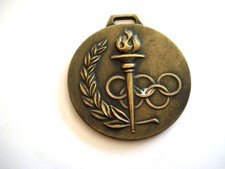 MEDAILLE FLAMME TORCHE DES JEUX OLYMPIQUES