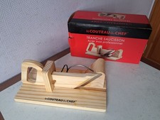 tranche saucisson bois/inox avec boite comme neuf.