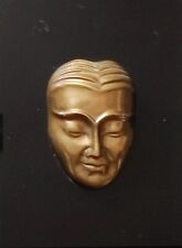 Visage asiatique en bronze