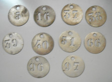 Anciens jetons en laiton