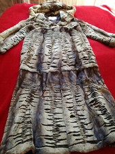 Long fur coat made of natural mink with laser trim