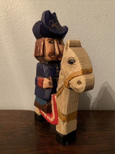 Wooden carved soldier riding - , a