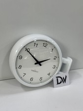 Horloge murale double face au