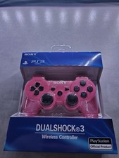 Lot de 2 manettes PS3 rose et