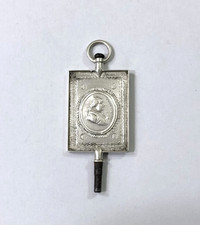 ancienne clé de montre à