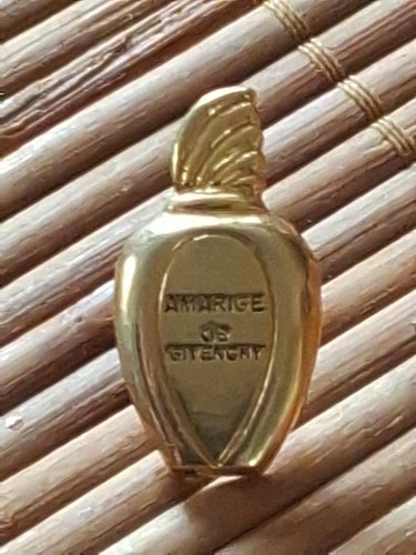 Pin parfum amarige de - parfum.,