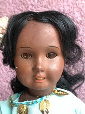 poupée noire en terre de pipe