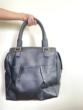 Sac en cuir LE TANNEUR 100% cuir, interieur tissus rouge, badge dorée