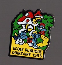 Pin's campagne de la Quinzaine de l'école publique 1993 / les schtroumpfs