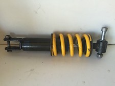 UNE SUSPENSION AMORTISSEUR