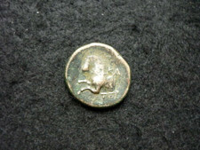 Pièce antique grecque tête