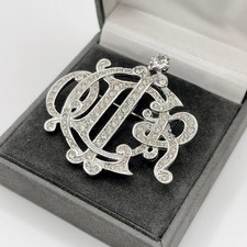 Broche Christian Dior emblème
