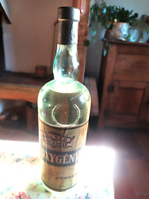 BOUTEILLE ANCIENNE ""OXYGENEE"" ELIXIR "" CUSENIER "" 1955 ""