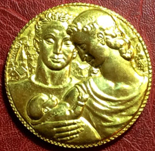 A couple with their child family association gold plated medal by L MULLER