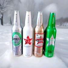 Superbe lot de 4 bouteilles heineken collector en aluminium