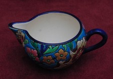 superbe ancien pot a lait en faïence émaux de Longwy bon état signé en dessous