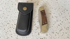 110USA BUCK Plain Blade Ebony