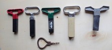 5 ANCIENS TIRE BOUCHONS A