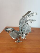 Grand coq de combat en métal argenté une patte relevée 18x22 cm