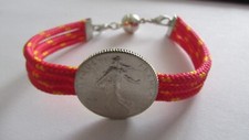 Bracelet, monté d'une monnaie