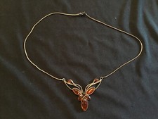 Collier argent papillon ambre