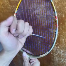 Raquette cordage poinçon