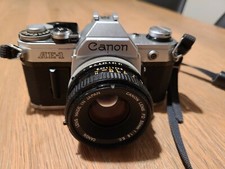 Appareil photo argentique CANON AE1 + objectif Canon FD 50mm 1:1.8 Fonctionne 