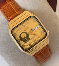 Montre vintage années 1980 Oris Exclusive logo Uae carré jour-date plaqué...