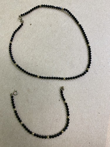 Costume black bead with gold - with,